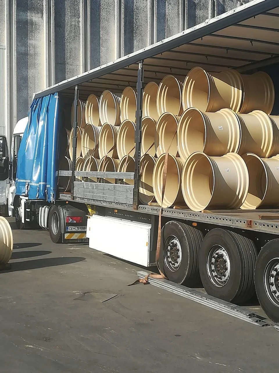 International transport of industrial cargo in a curtain-side trailer.